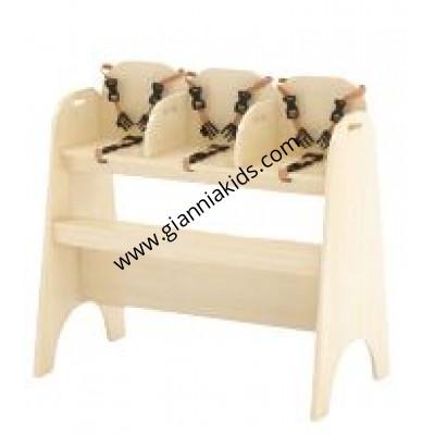 Three people feeding high chairs